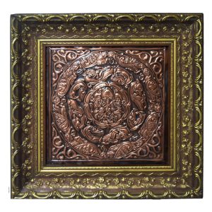 Decorative square frame with an ornate bronze embossed tile featuring a circular, intricate floral-spiral pattern at the center.